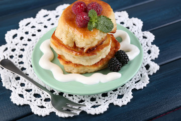 Tasty pancakes with fresh berries and mint leaf