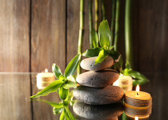 Spa stones, candles and bamboo branches