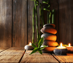 Spa stones, candles, bamboo branches