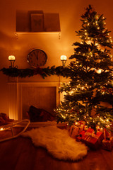 Christmas tree near fireplace in room