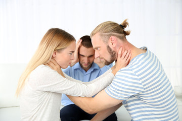 Young couple with problem on reception for family psychologist