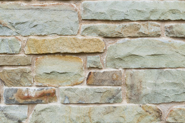 Antique or retro oxidized bicycle outside on a stone wall