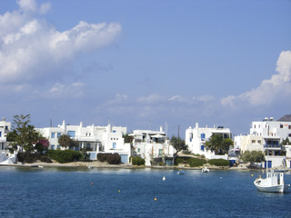typical beach community with Cyclades style white house blue doo