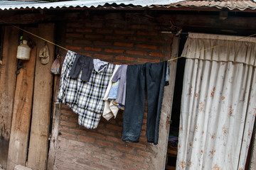 Fototapeta na wymiar Hung clothes of a thread in Nicaraguan house