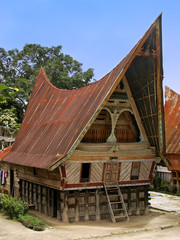 Traditional Batak house on Samosir island, Sumatra, Indonesia - obrazy, fototapety, plakaty