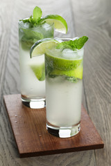 two mojito cocktails on old oak table