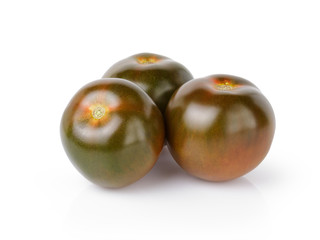 three whole kumato tomatoes