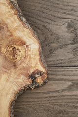 composition with olive wood board on top of oak table
