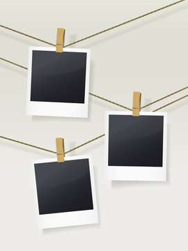blank photo frames on clotheslines