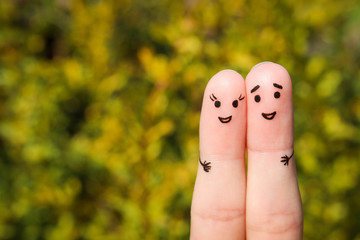 Finger art of a Happy couple. A man and a woman hug - obrazy, fototapety, plakaty