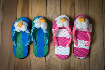 colorfull sandal with flower on wooden background