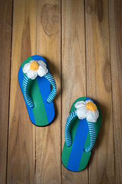 colorfull sandal with flower on wooden background