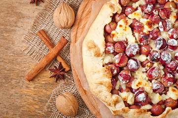 Galette with grapes and cheese sprinkled with powdered sugar