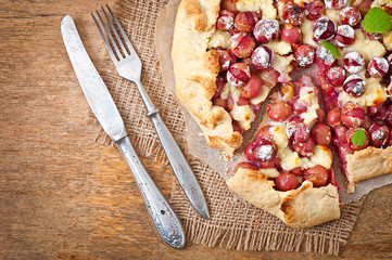 Galette with grapes and cheese sprinkled with powdered sugar