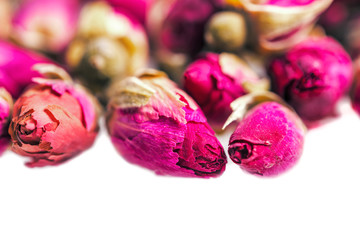 Closeup of dried rose buds on white background