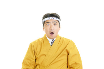 驚いた表情の料理人