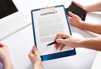 Hands holding a business contract