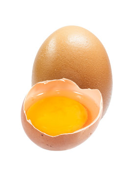 yalk in open eggshell isolated on white