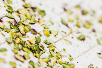 Obraz na płótnie Canvas Traditional eastern pistachio halva sliced into cubes