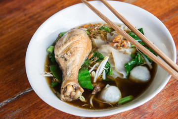 Chichken noodle on wooden table