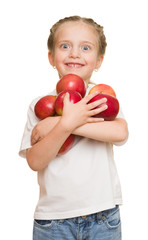 little girl with fruits and vegetables on white