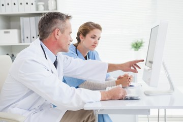 Fototapeta premium Doctor and nurse looking at a computer