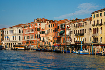 Fototapeta na wymiar Boats and gondolas in Grand canal in Venice, Italy.