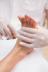 Salon worker with customers foot