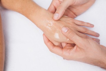 Obraz na płótnie Canvas Manicurist washing customers hand