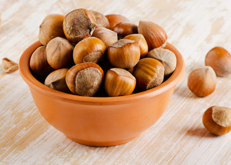 Hazelnuts on a  wooden background