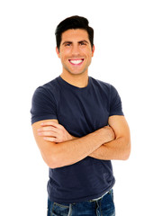 Portrait of a happy man with arms folded over white background