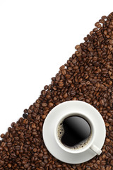 Cup of coffee on beans