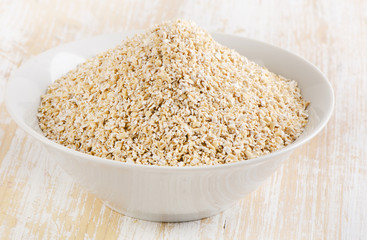 Healthy Oat bran on a  wooden table
