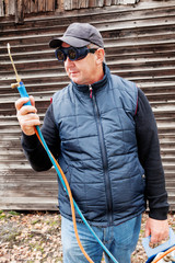 Construction worker with goggles and gas burner