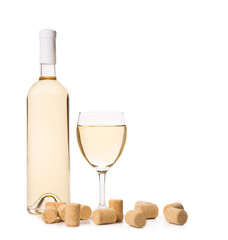 Glass of white wine with corks