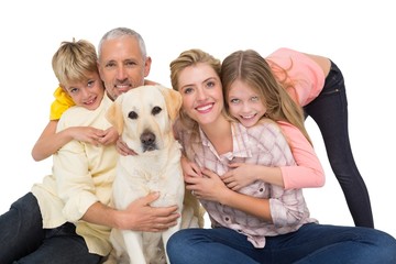 Obraz na płótnie Canvas Happy family with their pet dog