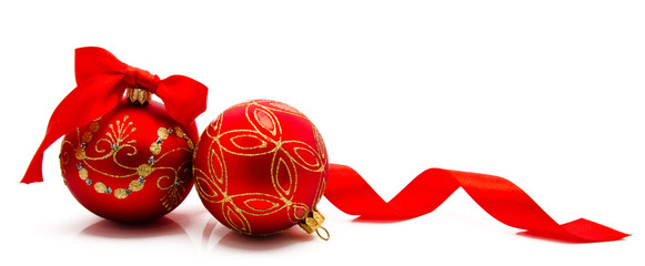 Two red christmas balls with ribbon isolated on a white