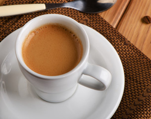 Cup of espresso coffee  on  wooden table