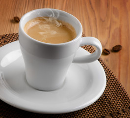 Cup of espresso coffee  on a wooden table