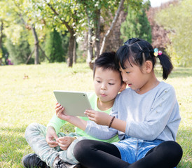 girl and a boy in the grass