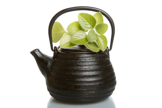 Typical asian teapot on white background.