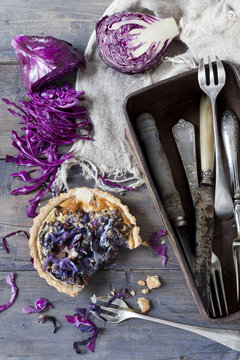 homemade purple cabbage quiche and vintage box with silverware