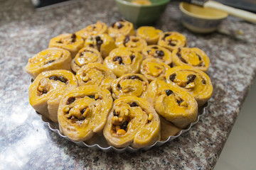 the dough of cinnamon roll with cashew nut and raisin