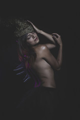 Nude warrior woman with golden helmet