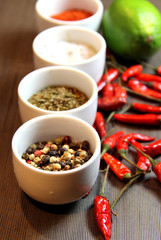 Mix of spices on the wooden background
