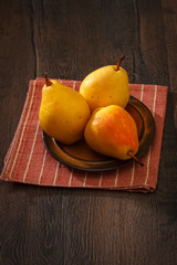 Ripe yellow pears on a plate