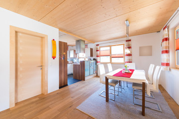 wooden warm mud of kitchen and dining room in timber house