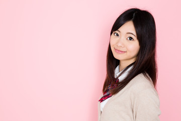 young asian woman on pink background