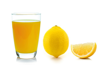lemon juice in a glass and lemon isolated on white background