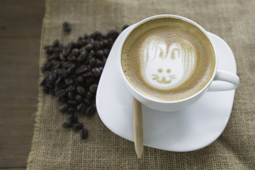 Easter rabbit drawing on latte art coffee cup
